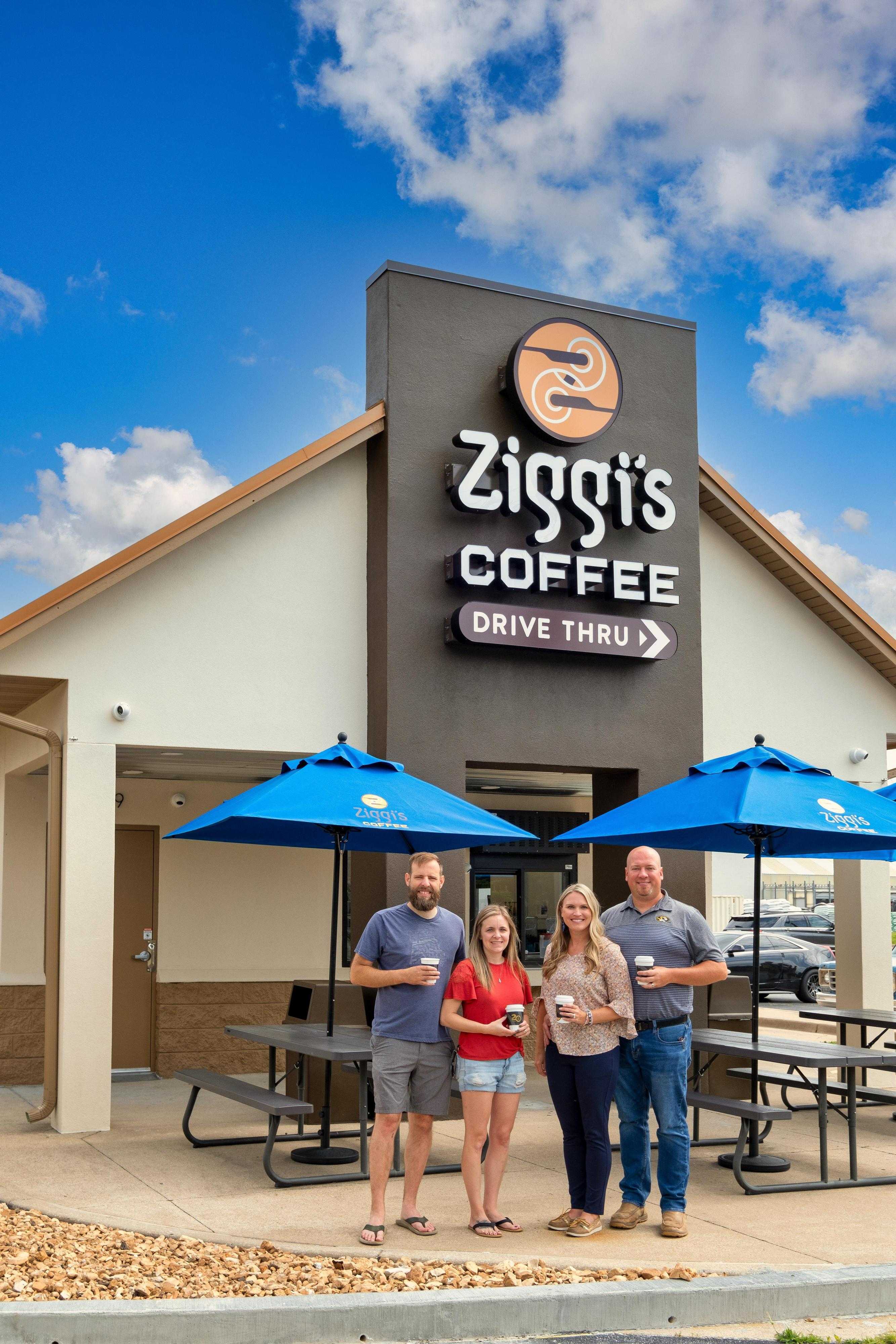Owners of Ziggi’s Coffee Carthage MO, Adam & Shelly Bridges with Eli & Vanessa Bruton, smiling outside drive-thru location.